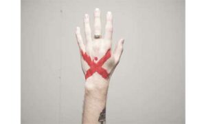 Hand-with-an-X-mark-with-ink