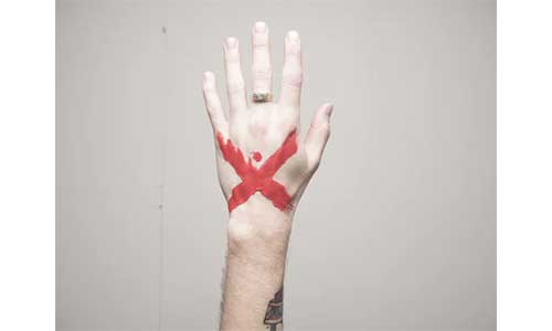 Hand-with-an-X-mark-with-ink